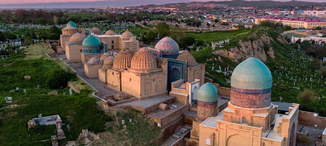 Heritage architecture at dusk — bespoke luxury journeys