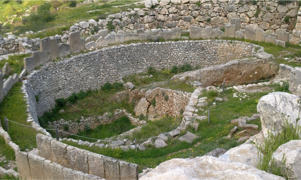 The circular stone walls of the ancient royal burial site Grave Circle A at Mycenae during an exclusive luxury private heritage tour departing from Athens with Lux Orient.