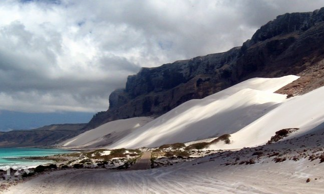 The rugged sand spits and crashing ocean surf at the geographic point of Ras Erissel on the far east coast of Socotra Island, Yemen, during an exclusive private luxury tour with Lux Orient.