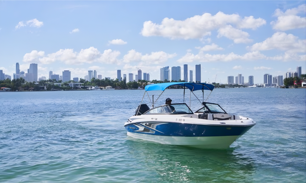 A luxury private charter yacht cruising smoothly through the deep blue waters of the Black Sea with the futuristic skyline and mountain backdrop of Batumi, Georgia, during an elite VIP excursion with Lux Orient.