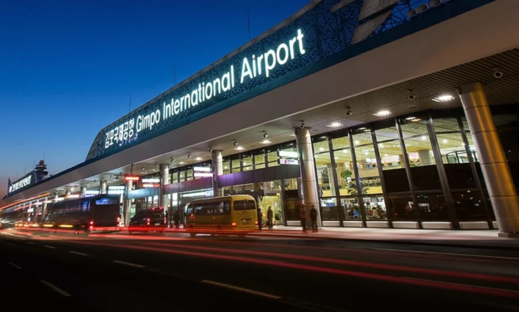 A premium private vehicle waiting outside the terminal gates of Gimpo International Airport following an arrival from Jeju Island, South Korea, during a luxury chauffeured transfer with Lux Orient.