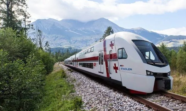 The sleek, modern silver and blue double-decker high-speed Stadler train traveling along the scenic tracks from Tbilisi to the Black Sea coastal resort of Batumi, Georgia, during a luxury private tour with Lux Orient.