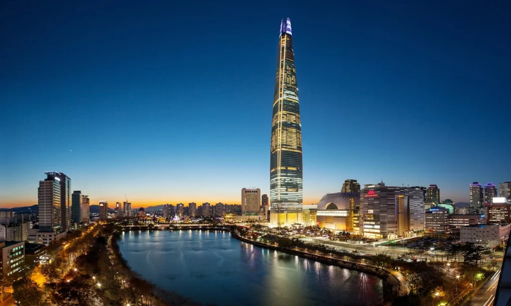The ultra-modern interior design, floor-to-ceiling glass windows, and spectacular high-altitude panoramic city skyline views from inside SIGNIEL Hotel Seoul, South Korea during an elite private luxury tour with Lux Orient.