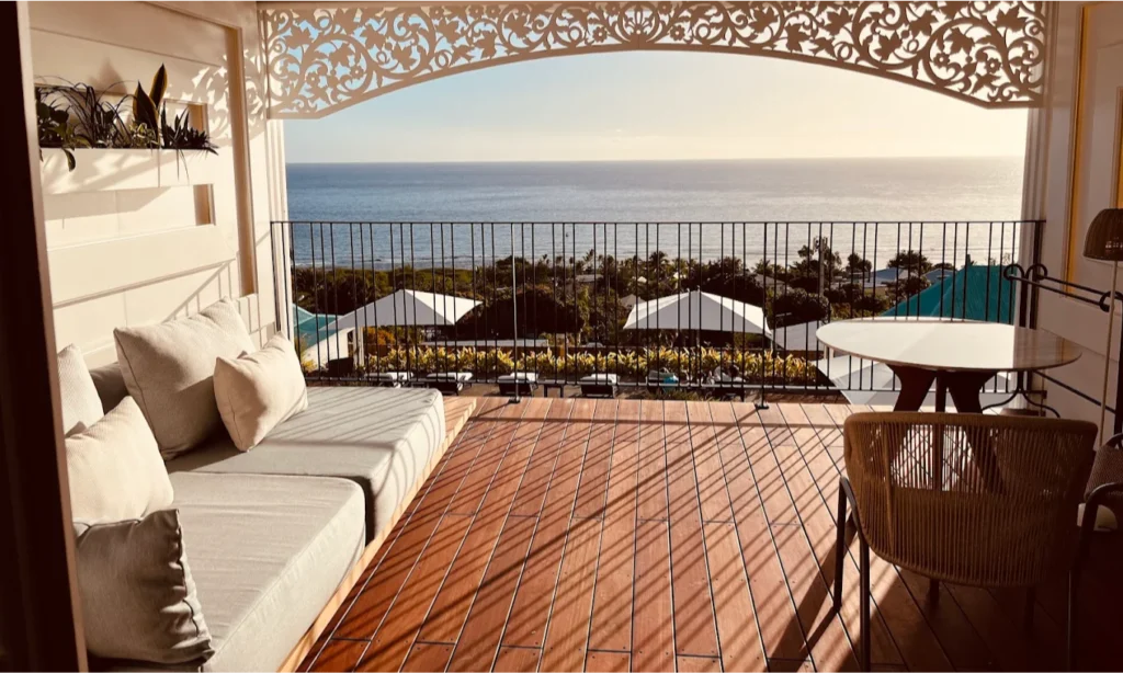 The elegant colonial architecture and sparkling private swimming pool overlooking the blue Indian Ocean at the luxury Blue Margouillat Seaview Hotel – Relais & Châteaux in Saint-Leu, La Réunion, during an exclusive vacation with Lux Orient.