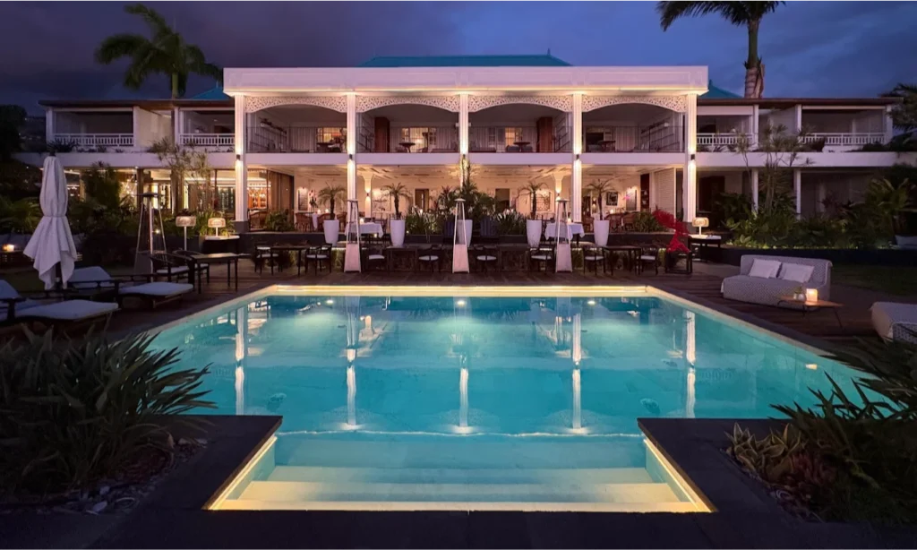 The elegant colonial architecture and sparkling private swimming pool overlooking the blue Indian Ocean at the luxury Blue Margouillat Seaview Hotel – Relais & Châteaux in Saint-Leu, La Réunion, during an exclusive vacation with Lux Orient.