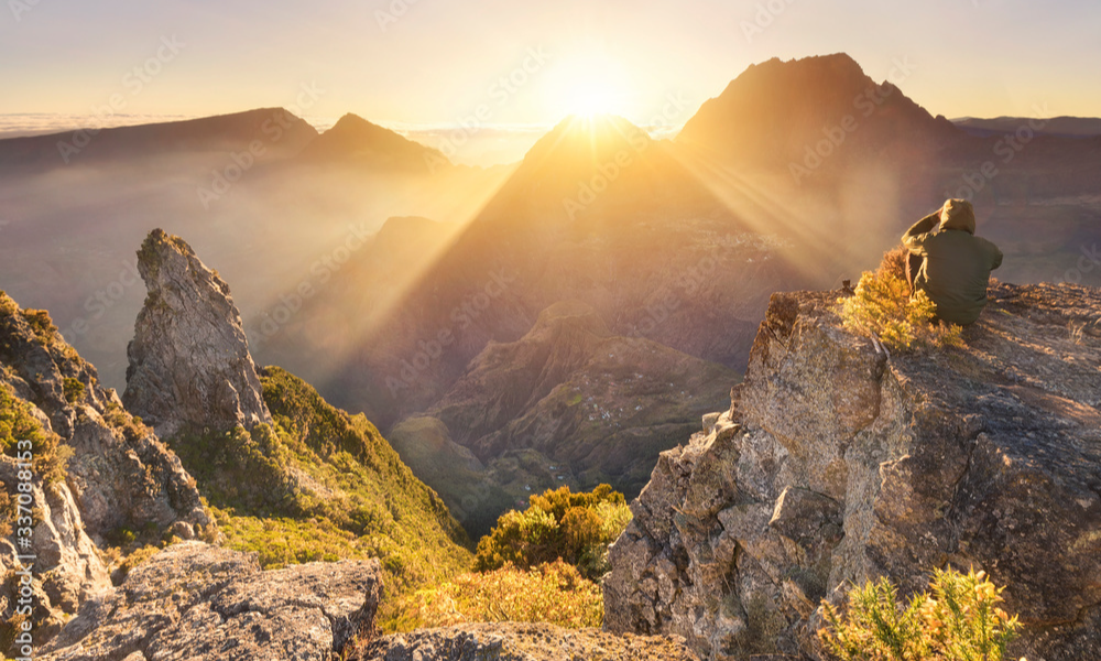 The dramatic rocky cliffs of the Maïdo Viewpoint overlooking the deep volcanic valleys and isolated mountain villages of the Mafate Cirque in La Réunion, during an elite private luxury tour with Lux Orient.