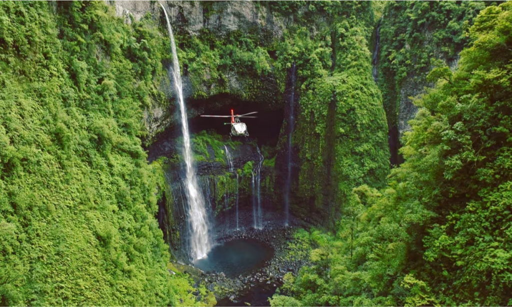 The dramatic vertical green canyon walls and towering mountain peaks of the lush Cirque de Salazie volcanic caldera in La Réunion, during an exclusive private luxury tour with Lux Orient.
