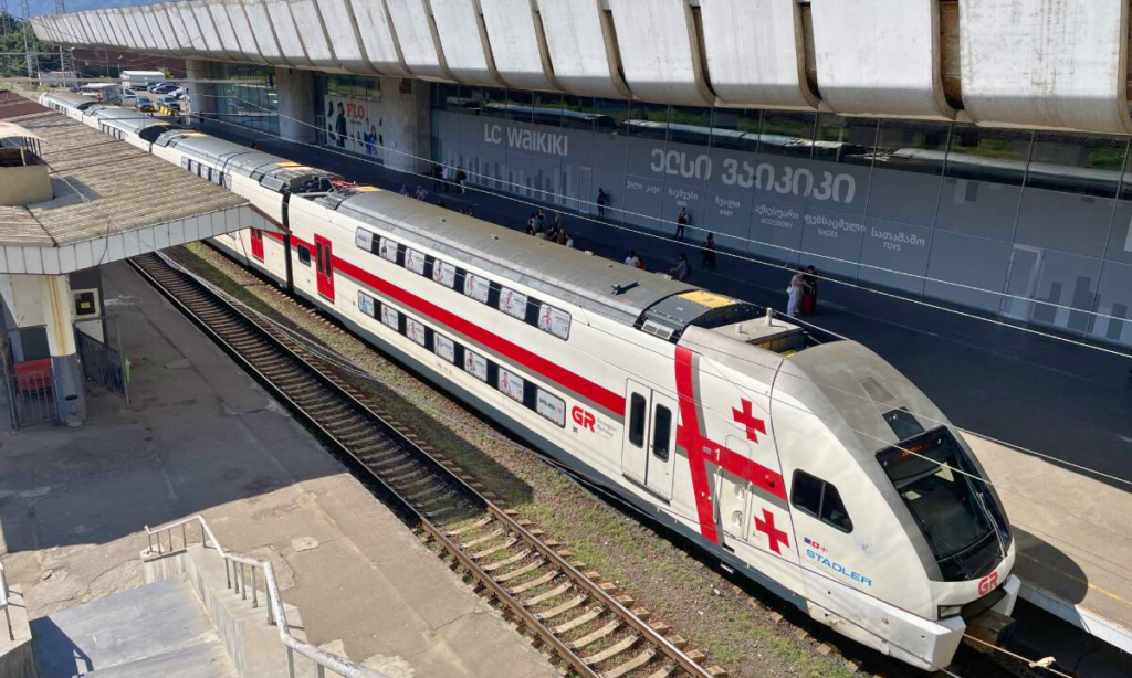 The modern silver double-decker Stadler high-speed train gliding along the scenic rail corridors from the coastal city of Batumi to the capital of Tbilisi, Georgia, during an elite private luxury tour with Lux Orient.
