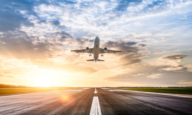 Passenger airplane taking of at sunrise